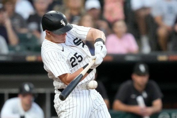 Chicago White Sox's Andrew Vaughn hits an RBI single off Detroit Tigers starting pitcher Tarik Skubal, scoring Corey Julks, during the third inning of a baseball game Saturday, Aug. 24, 2024, in Chicago. (AP Photo/Charles Rex Arbogast)