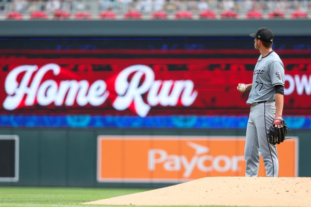 Chicago White Sox starting pitcher Chris Flexen reacts after giving up a three-run home run to Minnesota Twins' Royce Lewis during the second inning of a baseball game, Sunday, Aug. 4, 2024, in Minneapolis. (AP Photo/Matt Krohn)