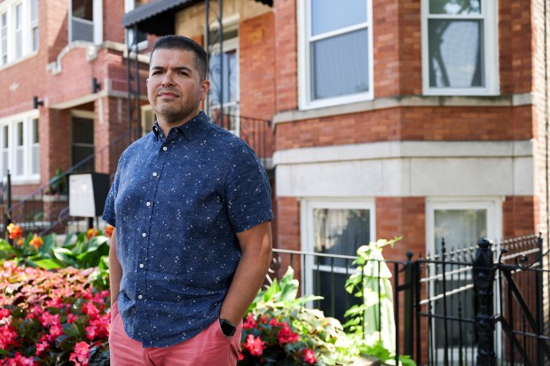 Property owner Miguel Chacon in front of a three-flat he owns on West 22nd Place in the Lower West Side neighborhood on July 22, 2024. Chacon has seen insurance rates rise for some of his buildings. (Eileen T. Meslar/Chicago Tribune)