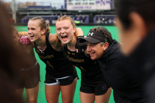 Northwestern field hockey head coach Tracey Fuchs celebrates with her players after winning their game against Maryland at Lakeside Field in Evanston on Oct. 26, 2023. (Eileen T. Meslar/Chicago Tribune)