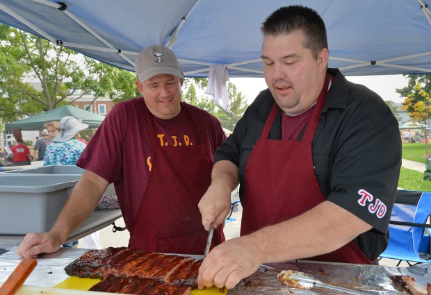 Brothers Donald and Todd Mills of the TJD Smokehouse team captured top honors in the 2018 Vine Street BBQ competition in Park Ridge. This year's cookoff will take place Sept. 16. (Brian O'Mahoney/Pioneer Press)