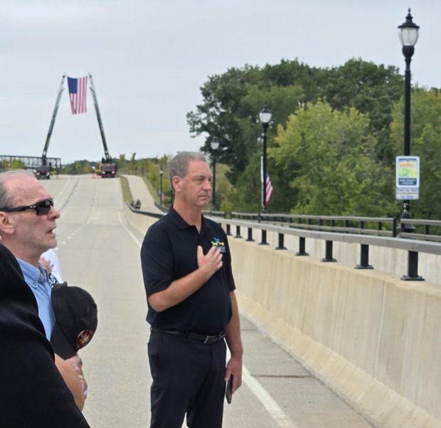 John Skillman, center, village president of Carpentersville, was among those on hand Thursday for a ribbon-cutting event for the Longmeadow Parkway and bridge over the Fox River. The parkway begins in his village and ends in South Barrington. (Gloria Casas/The Courier-News)