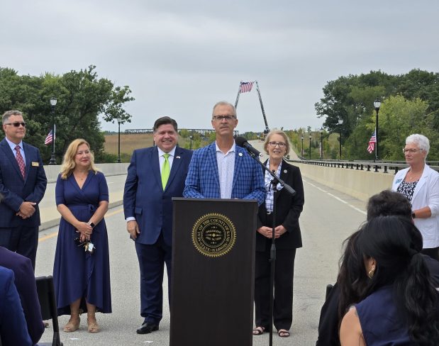 Carl Schoedel, director of the Kane County Division of Transportion, told those gathered for a ribbon-cutting Thursday that he's been working on the efforts to get the Longmeadow Parkway -- and its bridge over the Fox River -- built since 1997. (Gloria Casas/The Courier-News)