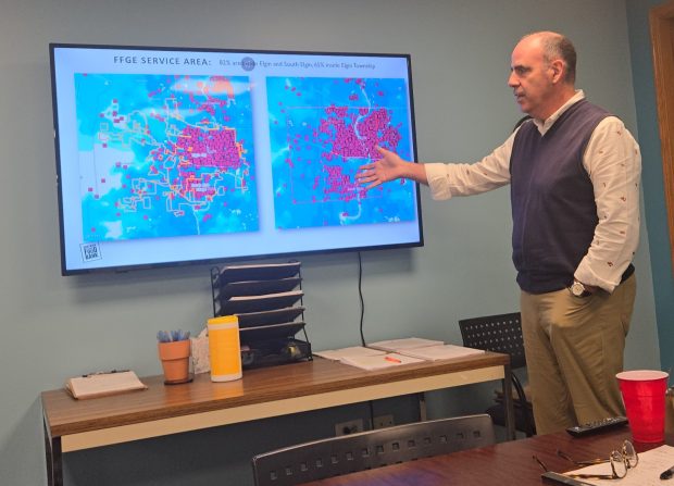 Food for Greater Elgin Executive Director Andres Deiz explains the pantry's demographics Friday during an event held to celebrate completion of its new 14,000-square-foot expansion. (Gloria Casas/The Courier-News)