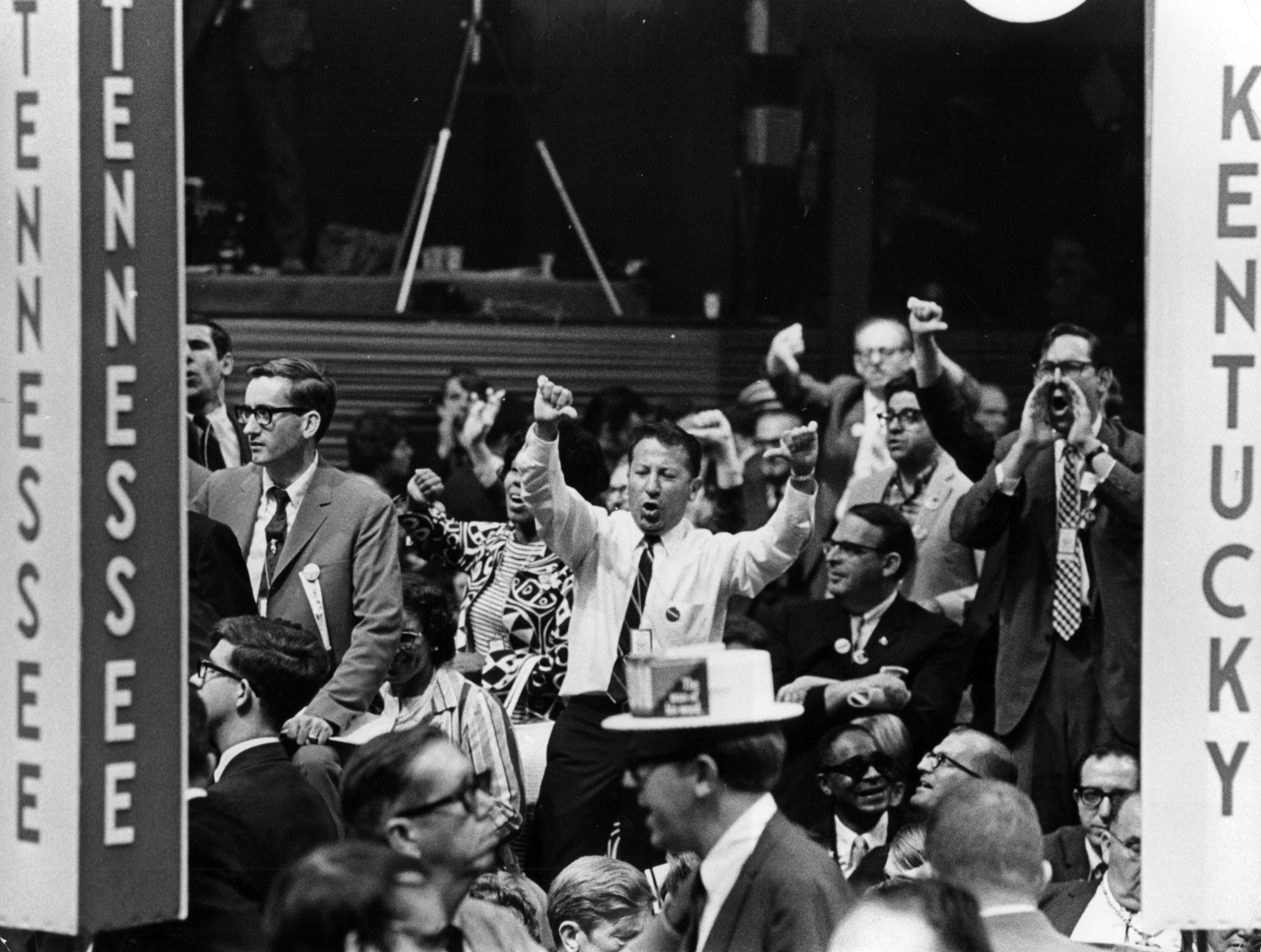 Delegates from New York protest on the floor of the...