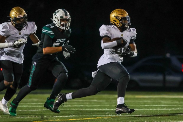 Richards' Myles Mitchell breaks free against Oak Lawn during a South Suburban Red game in Oak Lawn on Friday, Sept. 15, 2023.