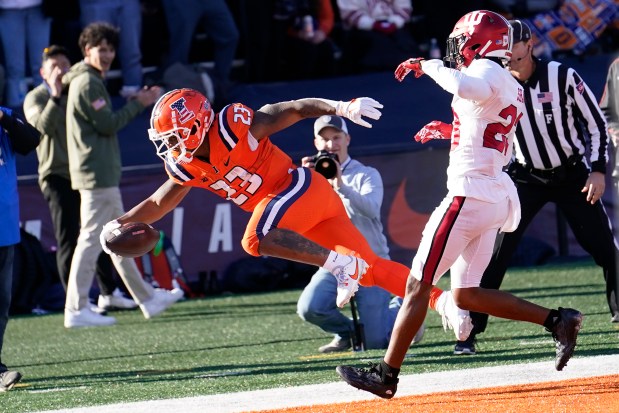 Illinois running back Reggie Love III scores a touchdown against Indiana on Nov. 11, 2023, in Champaign. (Charles Rex Arbogast/AP)