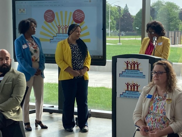 Dora King (right) recognizes state Sen. Adriane Johnson, D-Buffalo Grove (left), and state Rep. Rita Mayfield, D-Gurnee, for their efforts in returning an elected school board to North Chicago. (Steve Sadin/For the Lake County News-Sun)