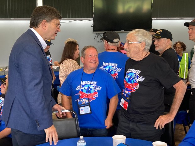 U. S. Rep Brad Schneider, D-Highland Park (left) talks to (from left) Mike Steiner and Bernie Parker. (Steve Sadin/For the Lake County News-Sun)