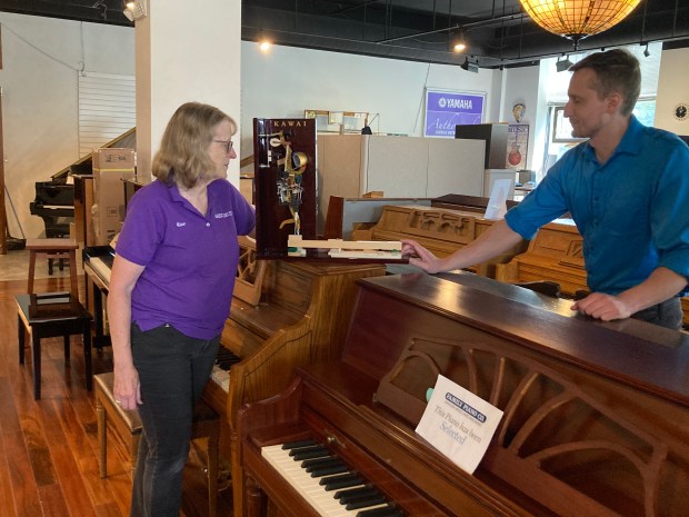 Family Piano founder Alice Alviani and her son, company President Brendan Alviani, talk business. (Steve Sadin/For the Lake County News-Sun)