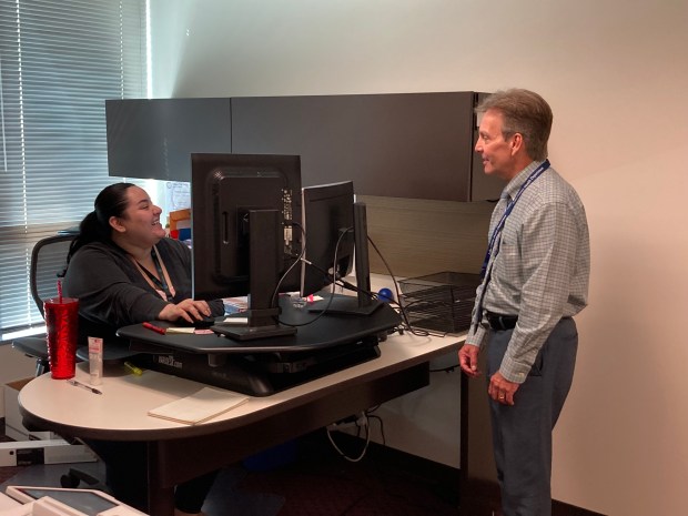 Mark Pfister, the executive director of the Lake County Health Department, talks to a member of his staff. (Steve Sadin/For the Lake County News-Sun)