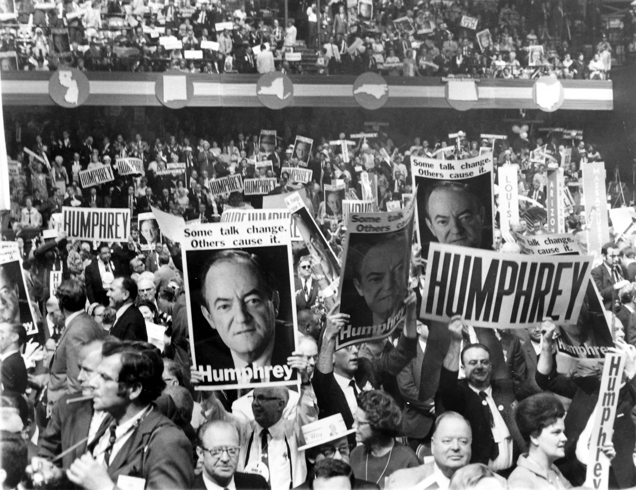 Delegates lift their placards for Vice President Hubert Humphrey in...