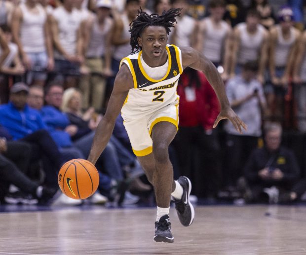 St. Laurence's Khalil Jones brings the ball up the court against Marist during the Chicago Elite Classic at Credit Union 1 Arena in Chicago on Friday, Dec. 1, 2023. (Vincent D. Johnson / Daily Southtown)