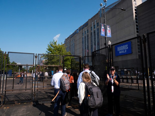 Naperville Central High School seniors Sarah Segvich and C.J. Getting walk into Chicago's United Center on Monday, Aug. 21, 2024, as they prepare to report on the Democratic National Convention. (Tess Kenny/Naperville Sun)