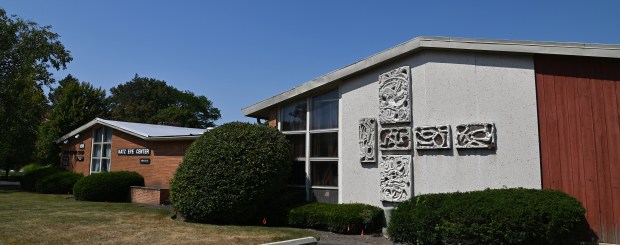 This is 1290 Shermer Road, known recently as Katz Eye Center and also Northbrook's first standalone library built in 1954. On right is a six panel relief sculpture. The wing with the sculptured panels was added in 1961. Guido Chigi, a Glenbrook High School instructor and Chigi's students designed and built the panels. Taken on Aug. 25, 2024. (Karie Angell Luc/Pioneer Press)