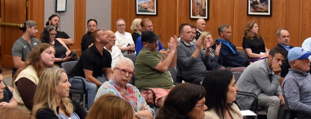 Audience applause in favor of scrapping the Hometown Coffee & Juice economic incentive agreement proposal in the boardroom at Northbrook Village Hall on Aug. 27, 2024. (Karie Angell Luc/Pioneer Press)