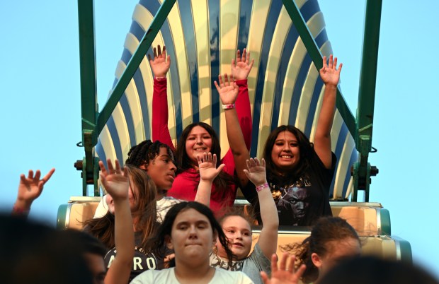 Far right, top row on Pharaoh's Fury is Daniela Montejano of Dunning Square at the Village of Harwood Heights Annual Summer Festival and Carnival on Aug. 2, 2024 in Harwood Heights at Saint Monica and Rosalie Roman Catholic Parish (6750 W. Montrose Ave.) in Harwood Heights (Karie Angell Luc/Pioneer Press)