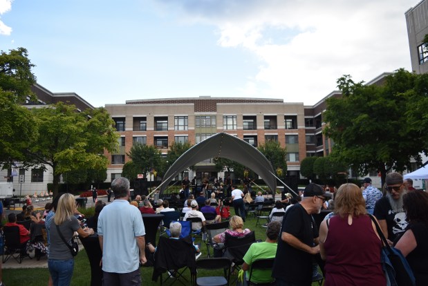 Despite a series of rain showers all day, by the time the music got underway at the Taste of Burr Ridge, storm clouds gave way to blue skies and crowds packed the green. (Jesse Wright for the Pioneer Press)