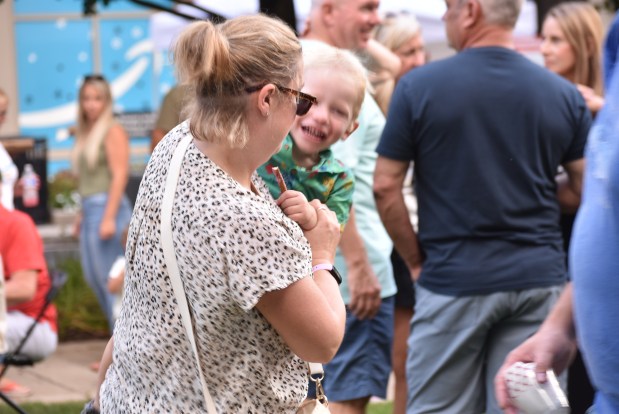 Jessica Bloom entertains Augie Kulka Saturday evening at the Taste of Burr Ridge. (Jesse Wright for the Pioneer Press)