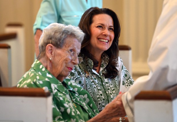 From left, Ruth Gamber, a six-decade resident of Glenview and Jennifer Farber of Glenview say hello to Bishop Jeffrey Grob of Elmwood Park before mass and the dedication and blessing of the church bells and clock tower on Aug. 11, 2024 at (OLPH) Our Lady of Perpetual Help Catholic Church in Glenview (1775 Grove St.). (Karie Angell Luc/Pioneer Press)