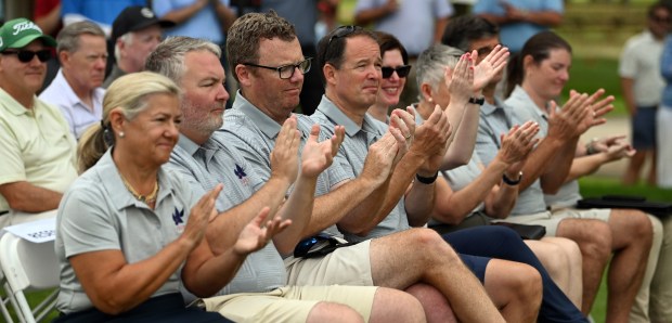 Far left, front row, Winnetka Park District Board of Commissioners President Christina Codo is among attendees of the ribbon cutting and grand opening program on Aug. 12, 2024 in Winnetka at the Winnetka Golf Club (1300 Oak St.). (Karie Angell Luc/Pioneer Press)