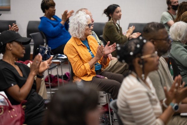 Visitors applaud during a community conversation at the Hammond Public Library on the proposed BP CO2 pipeline on Wednesday, Aug. 21, 2024. (Kyle Telechan/for the Post-Tribune)