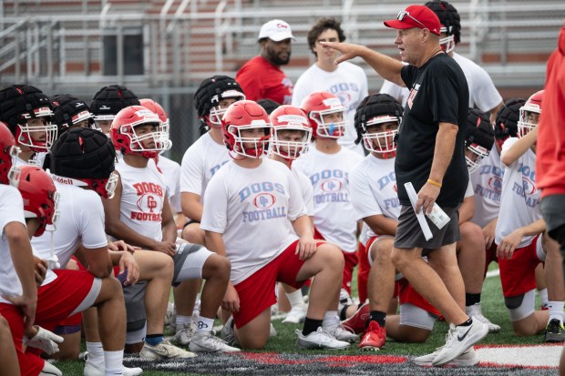 Crown Point head coach Craig Buzea speaks with his team during a practice on Monday, Aug. 5, 2024. (Kyle Telechan/for the Post-Tribune)