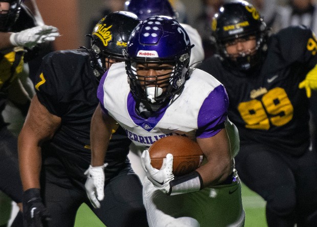 Merrillville's Jac'Quarious Johnson runs the ball during the Class 5A semistate game against host Fort Wayne Snider on Friday, Nov. 17, 2023. (Michael Gard / Post-Tribune)