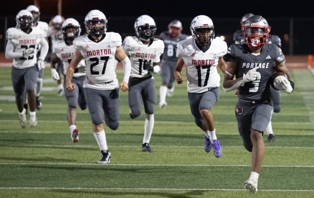 Portage running back Ogbonna Williamson Jr. breaks away from Morton defense as he makes a touchdown run from a kickoff on Friday, Aug. 23, 2024. (Kyle Telechan/for the Post-Tribune)