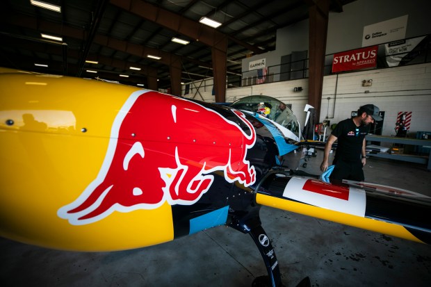 Jason Resop, crew chief for the Red Bull 300L, finished his getting the plane ready before rehearsal flight for the Gary Air Show, at the Gary Jet Center, on Friday, Aug. 16, 2024, in Gary. (Vincent D. Johnson/for the Post-Tribune)