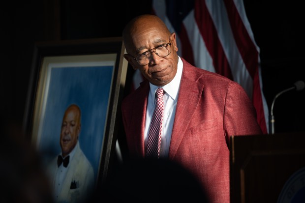 Artist Gerri Browning stands near his portrait of former Gary mayor Jerome Prince during an unveiling ceremony at Gary City Hall on Monday, Aug. 26, 2024. (Kyle Telechan/for the Post-Tribune)