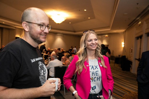 Jim Harper, left and Erin Collins, talk with media members during a breakfast held by the Indiana Democrats, on Monday, Aug. 19, 2024, in Chicago. (Vincent D. Johnson/for the Post-Tribune)