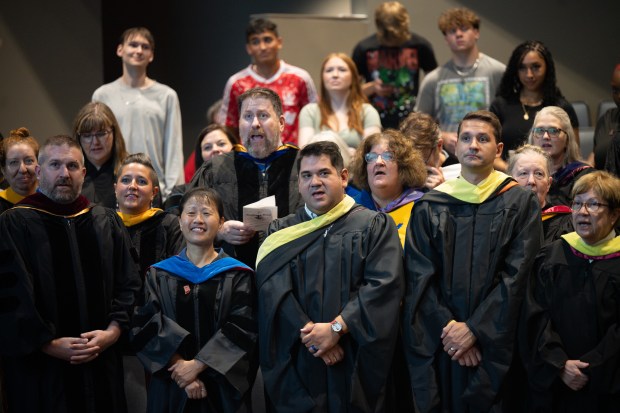 Faculty sing "Hail to the Old IU", the school's official Alma Mater song, during the school's induction ceremony on Tuesday, Aug. 27, 2024. (Kyle Telechan/for the Post-Tribune)