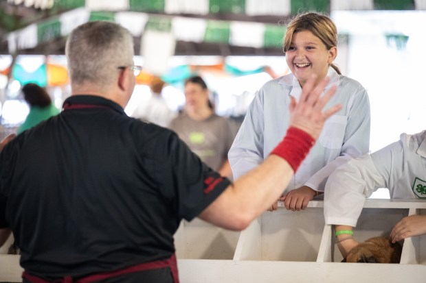 Ela Ripperdan, 11, of Hebron, reacts to good news about her bunny, "Dusk" as they compete in the 4-h show rabbit competition at the Lake County Fair in Crown Point on Tuesday, Aug. 6, 2024. (Kyle Telechan/for the Post-Tribune)