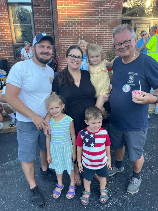 From left, Conrad Szklarz, Evita Szklarz, Josephine Szklarz and Marek Predki with Violet and Samuel Szklarz in the front row pause during the Chicago to Northwest Indiana pilgrimage in Aug. 2023. (Photo courtesy of Evita Szklarz)