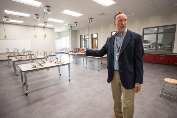 Yost Elementary principal Josh Huwig speaks about a room in the new school dedicated to science, technology, engineering, and math programs, during a tour of the facility on Thursday, Aug. 1, 2024. (Kyle Telechan/for the Post-Tribune)