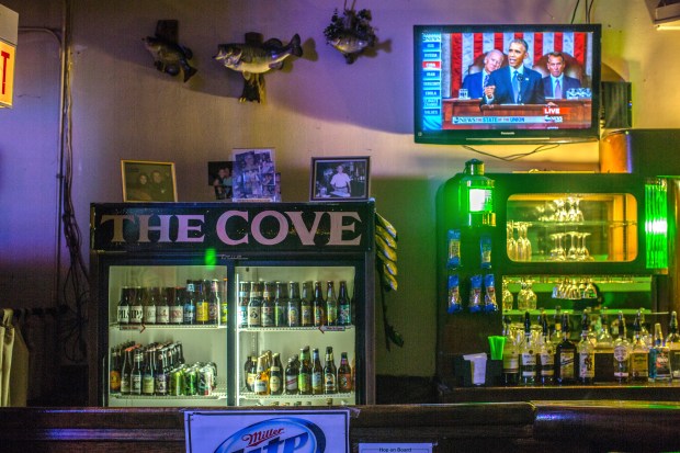 President Barack Obama appears on a television delivering a State of the Union speech at the Cove Lounge in Chicago on Jan. 22, 2015. ( Lenny Gilmore / RedEye )