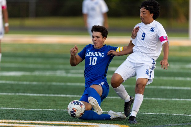 Sandburg's Joseph Gentile (10) and Bloom Township's Christopher Mendez (9) race to a ball during the Windy City Ram Classic first-round game, in Tinley Park on Wednesday, Aug. 28, 2024. (Vincent D. Johnson/for the Daily Southtown)