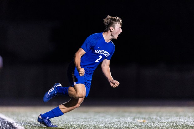 Sandburg's Giovanni Longo (2) celebrates after a penalty shoot-out goal during the Windy City Ram Classic first-round game against Bloom Township, in Tinley Park on Wednesday, Aug. 28, 2024. (Vincent D. Johnson/for the Daily Southtown)