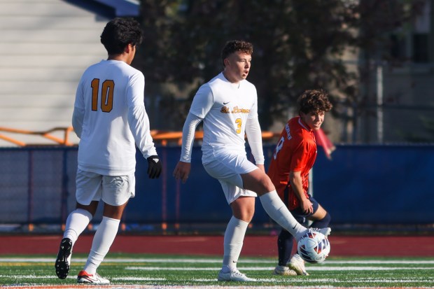 St. Laurence's Matthew Suchecki (3) wins possession of the ball during the IHSA Class 3A third-place game against Rochester in Hoffman Estates on Saturday Nov. 4, 2023. (Troy Stolt for the Daily Southtown)