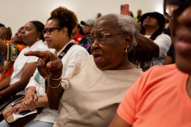 Ann Johnson, resident of Dolton for 33 years, reacts as she learns that Mayor Tiffany Henyard's administration used credit cards to spend $43,329.92 in one day, Jan. 5, 2023, on Amazon, during Former Chicago Mayor Lori Lightfoot's presentation Aug. 8, 2024. (Tess Crowley/Chicago Tribune)