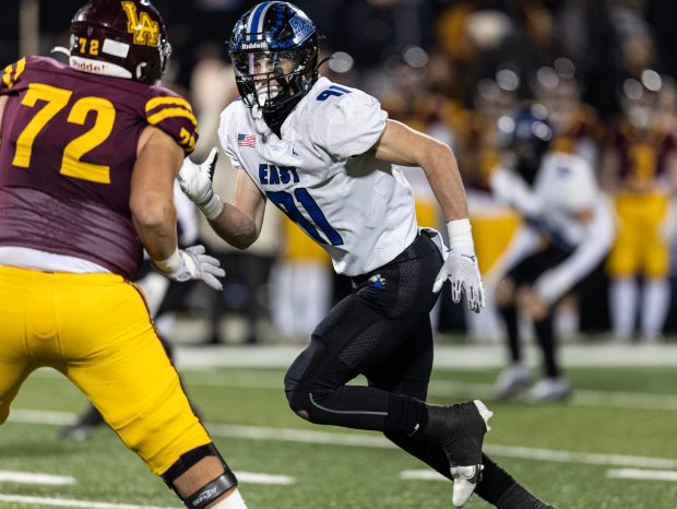 Lincoln-Way East's Caden O'Rourke (91) tries to get around Loyola's Pan Mihalopoulos (72) during the Class 8A state championship game, at Memorial Stadium in Champaign, on Saturday, Nov. 26, 2022. (Vincent D. Johnson / Daily Southtown).