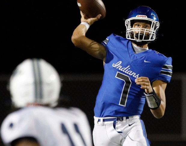 Lake Central quarterback Chase Kwiatkowski (7) throws on the run during a football game against Michigan City on Friday, Aug. 22, 2023. (John Smierciak/ Post Tribune)