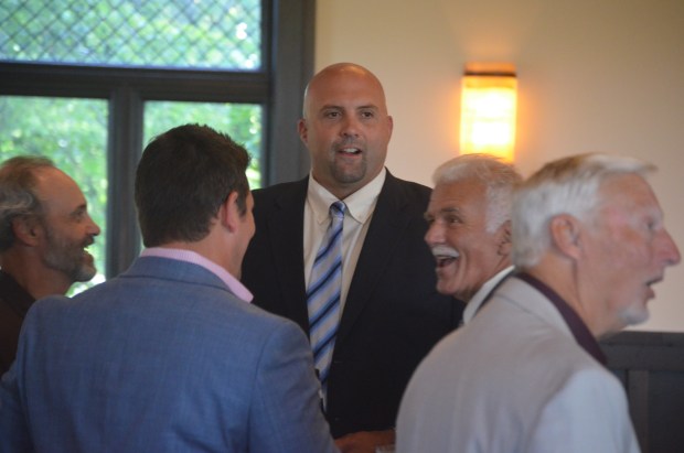 Former Lockport standout Tony Pashos, who played 104 games in the NFL, talks with a group at the Lockport Legends ceremony at Mistwood Golf Club in Romeoville on Friday, Juy 26, 2024. (Jeff Vorva / Daily Southtown)