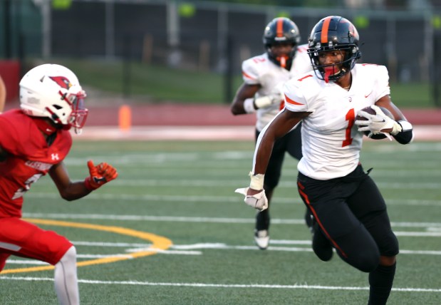 Lincoln-Way West's DeAndre Coates runs the ball against Eisenhower during football game in Blue Island on Friday, Aug. 30, 2024. (James C. Svehla / Daily Southtown)