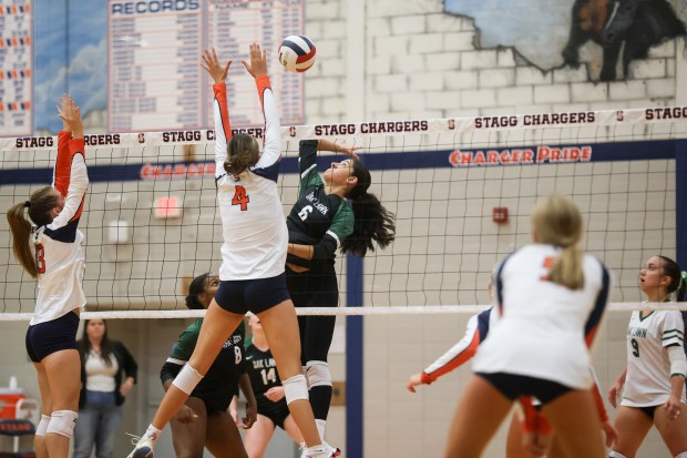 Oak Lawn's Maryam Hussein (6) spikes the ball during a volleyball game against Stagg in Palos Hills on Wednesday, Aug. 28, 2024. (Troy Stolt for the Daily Southtown)