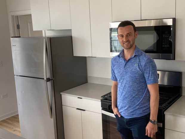 Matt Shamis, with Advantage Properties, in the kitchen of a two-bedroom apartment at 157th Street and Cicero Avenue in Oak Forest on Aug. 2, 2024. (Mike Nolan / Daily Southtown)