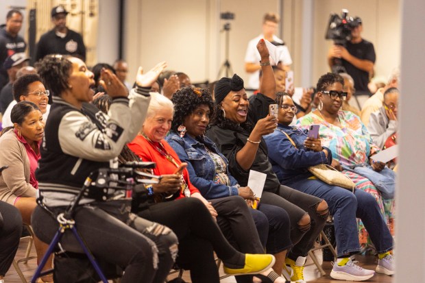 A crowd of mostly residents claps and cheers loudly Aug. 20, 2024, after the Thornton Township Board voted for an ordinance many believe will rein in spending by Supervisor Tiffany Heynard. (Vincent D. Johnson/for the Daily Southtown)