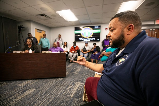 Keith Price, aide to Thornton Township Supervisor Tiffany Henyard, answers some questions Aug. 15, 2024, during a board meeting in South Holland. (Vincent D. Johnson/for the Daily Southtown)