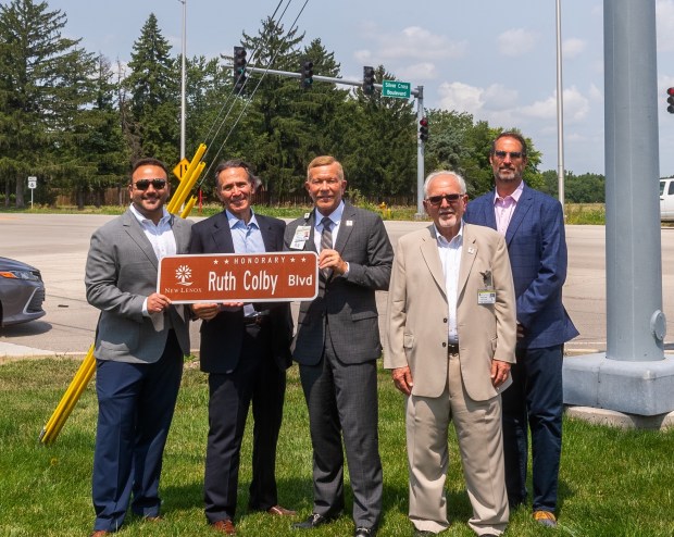 Hospital and village officials gather recently for a ceremony marking the designation of Silver Cross Boulevard as Honorary Ruth Colby Boulevard in honor of the late president of the hospital in New Lenox. (Silver Cross Hospital)